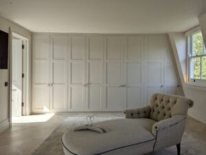 bespoke loft wardrobes across the wall